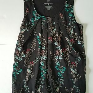 Dressy tank top with pleated neck.